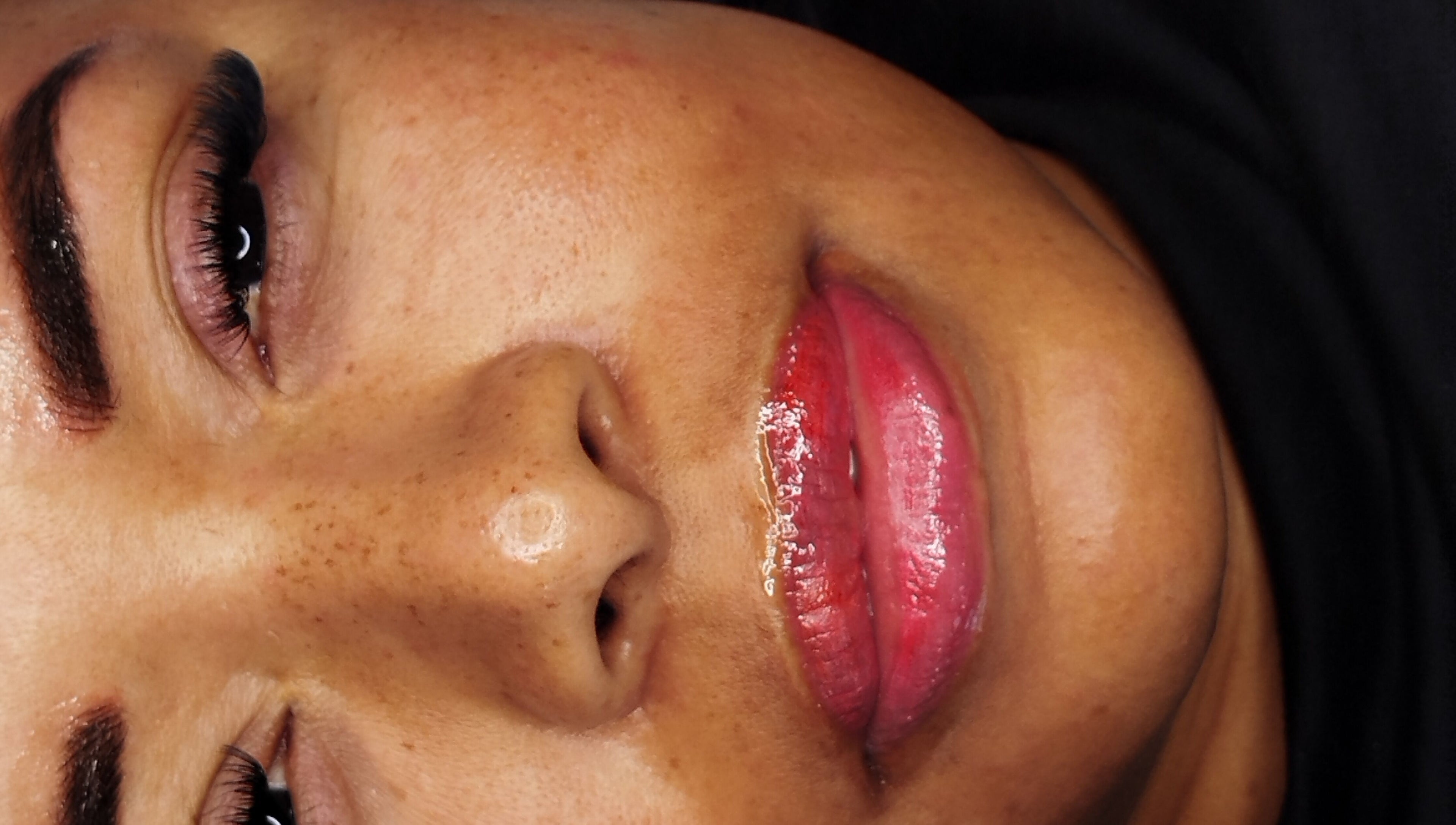 Close-up of enhanced eyelashes and lips at ILashed, Cape Town, South Africa, ZA.