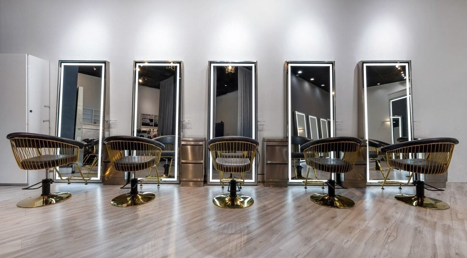 Modern salon chairs and mirrors at Mophead Aberdeen, Richmond, British Columbia, CA.