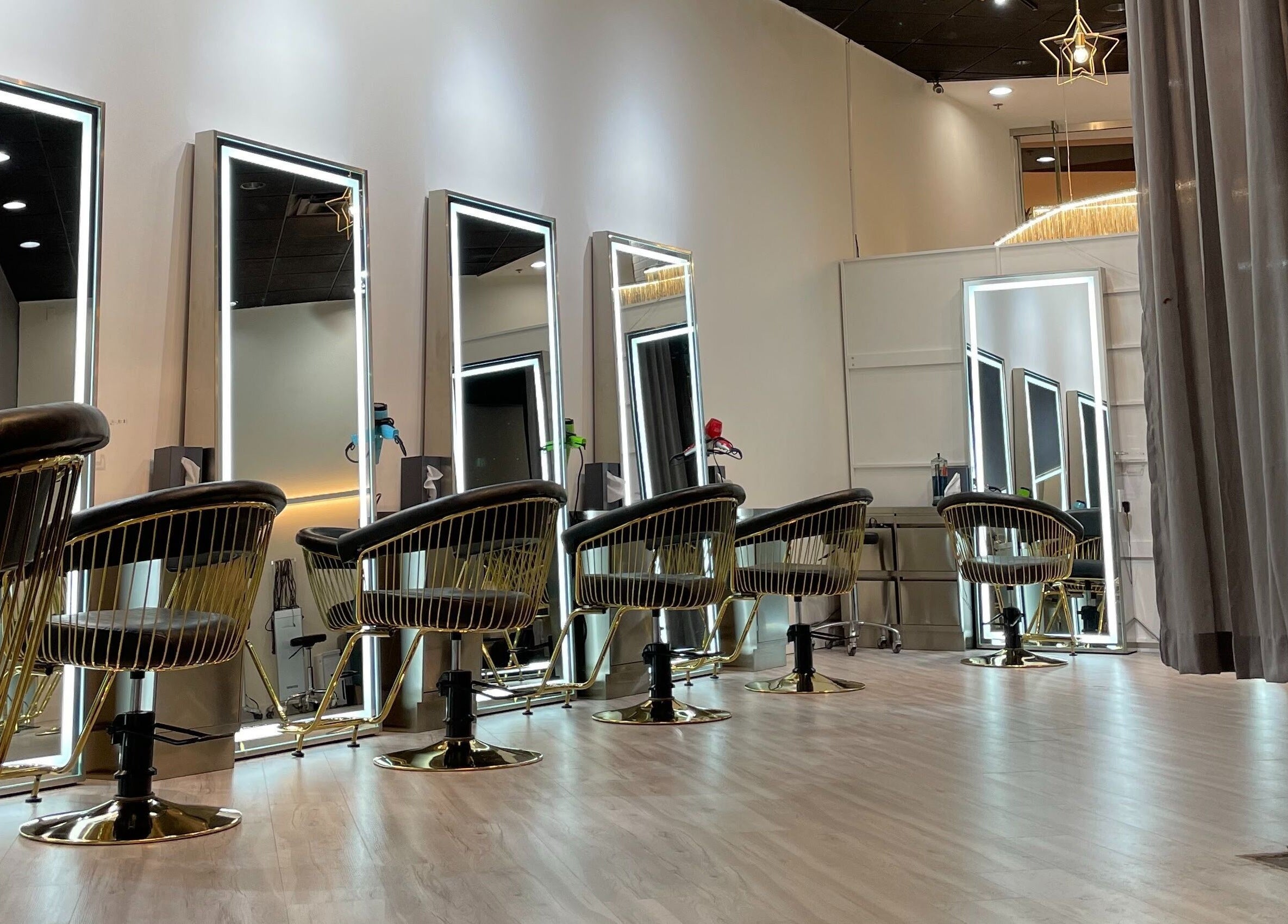 Modern salon chairs and mirrors at Mophead Aberdeen, Richmond, British Columbia, CA, showcasing elegance.