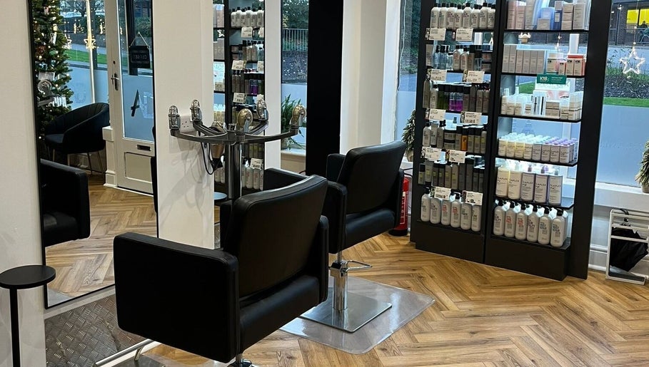 Interior of Andrew David Hair, Lymington, England featuring salon chairs and product shelves.