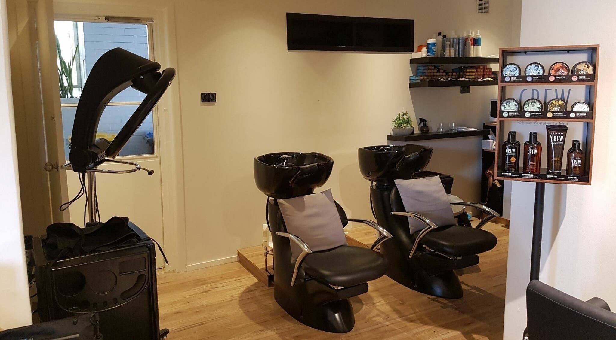 Modern wash stations at Into Hair Salon, Seaforth, New South Wales, AU offering a relaxing salon experience.