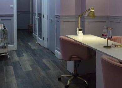 Elegant spa interior at Vintage in Salford, England, GB featuring plush chairs and a manicure station.