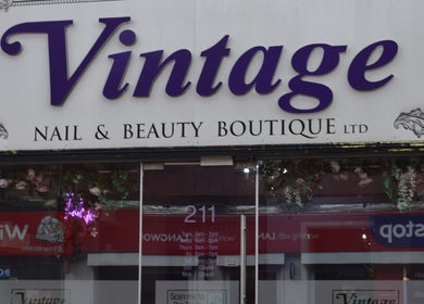 Front view of Vintage nail and beauty boutique in Salford, England, GB, featuring elegant signage.