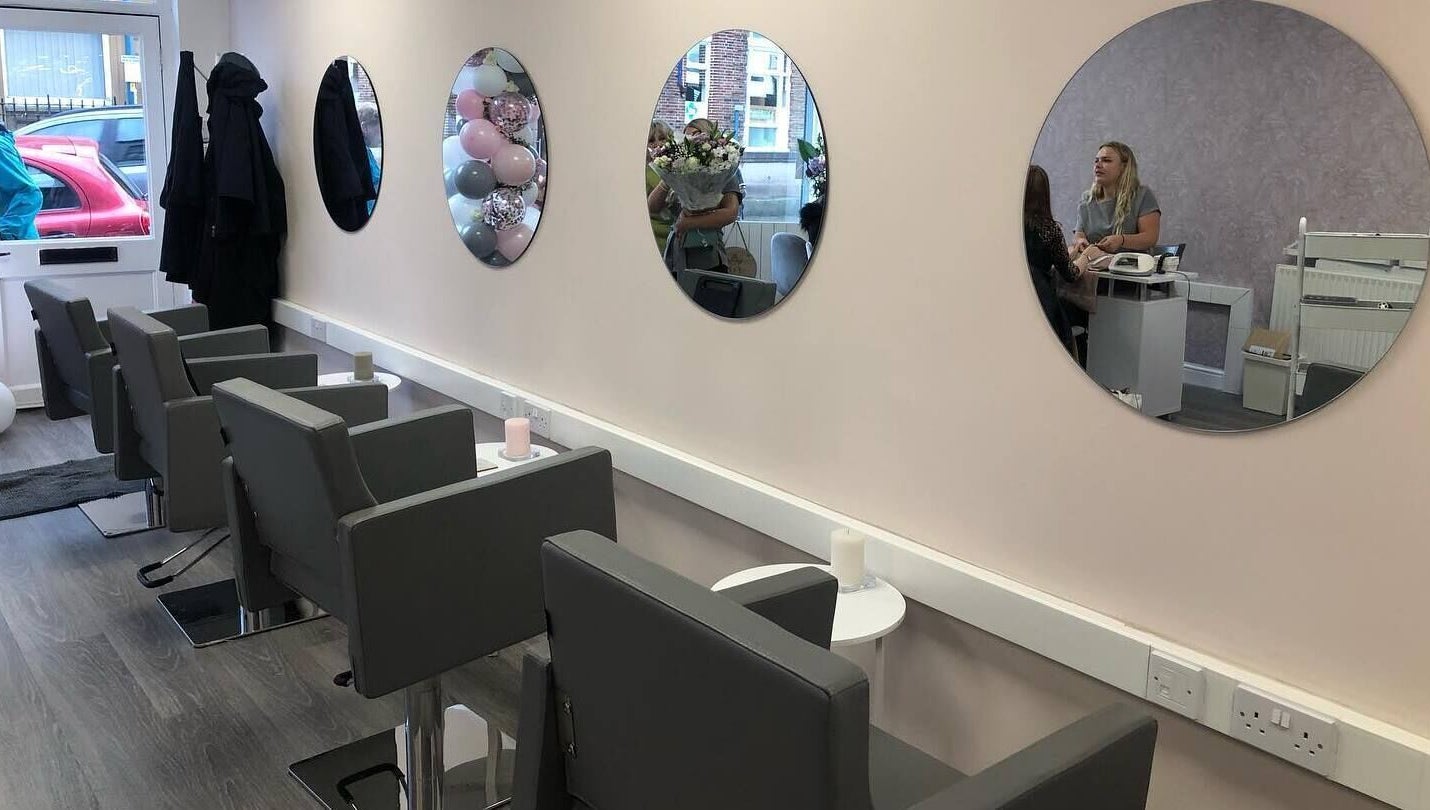 Modern salon chairs and mirrors at KH Hair & Beauty, Stalybridge, England, GB.