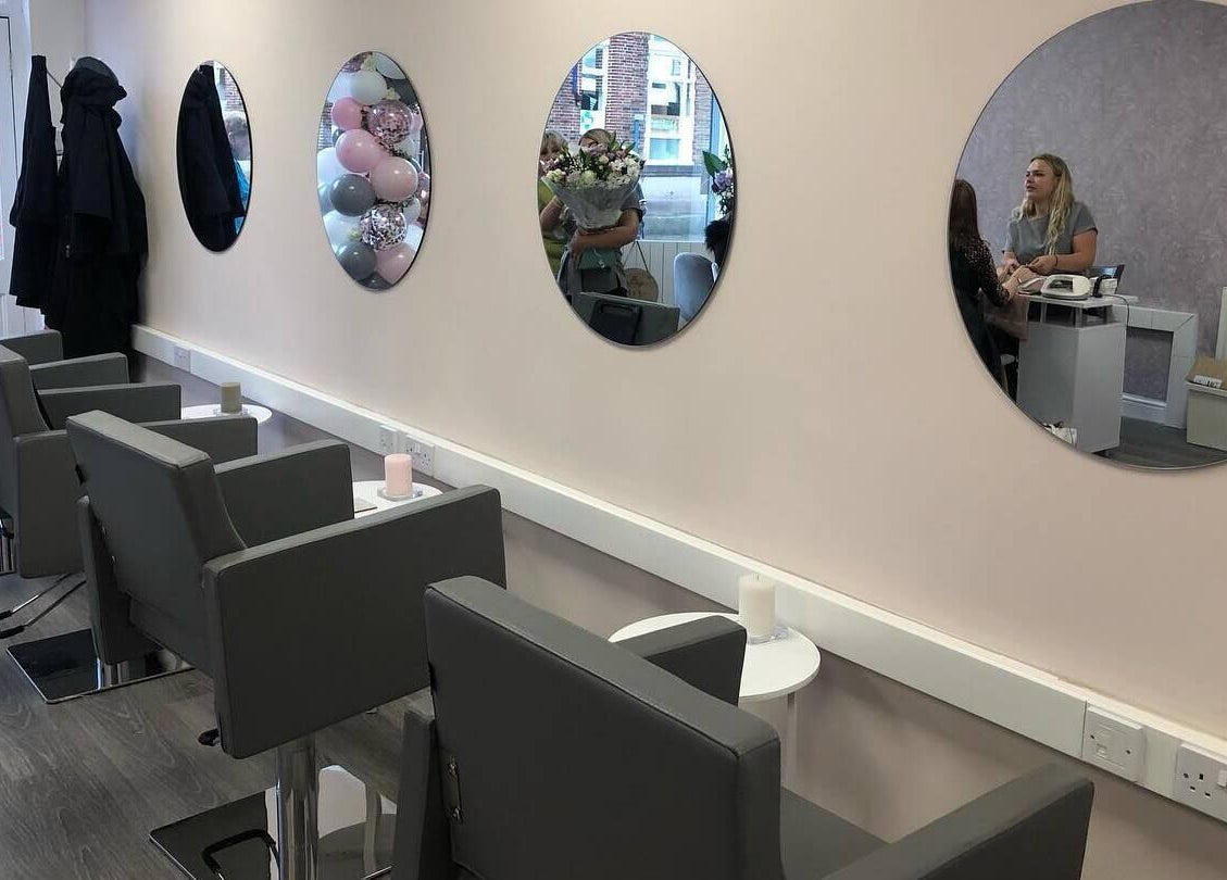 Modern salon chairs and mirrors at KH Hair & Beauty, Stalybridge, England, GB.
