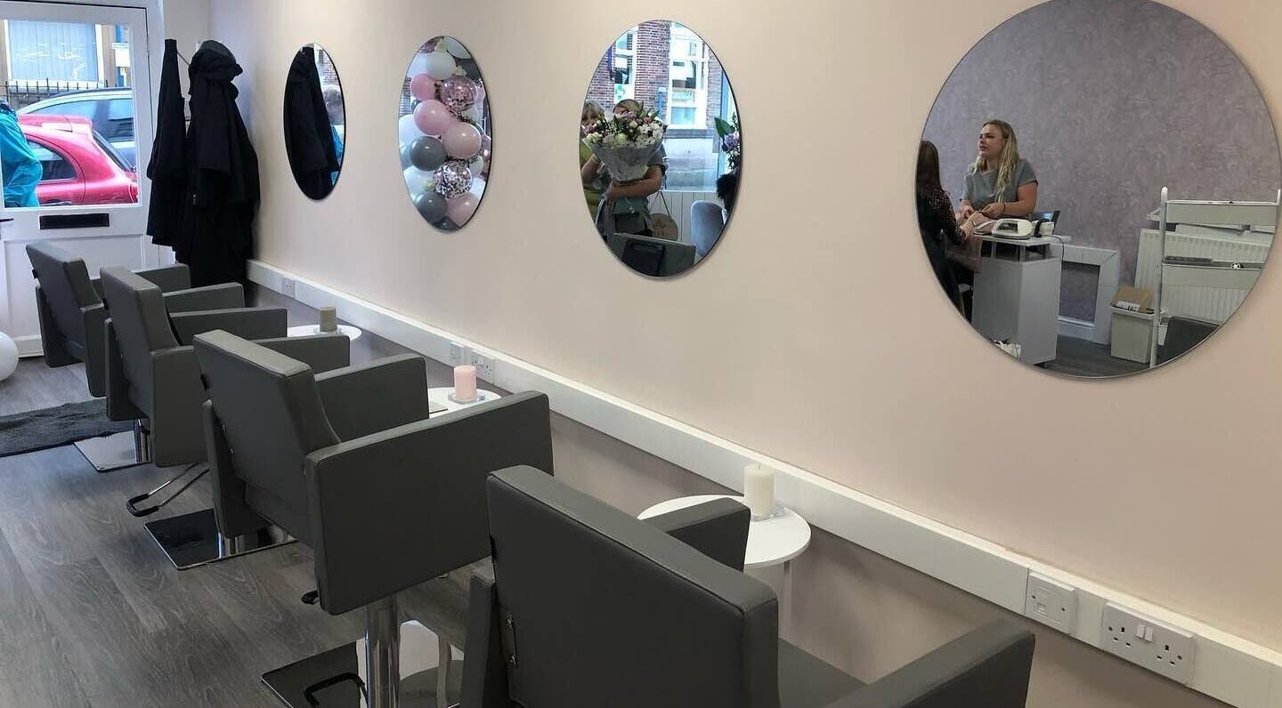 Modern salon chairs and mirrors at KH Hair & Beauty, Stalybridge, England, GB.