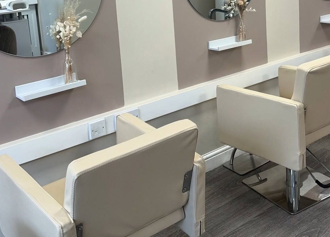 Stylish salon chairs and mirrors at KH Hair & Beauty, Stalybridge, England, GB, offering a modern beauty setting.