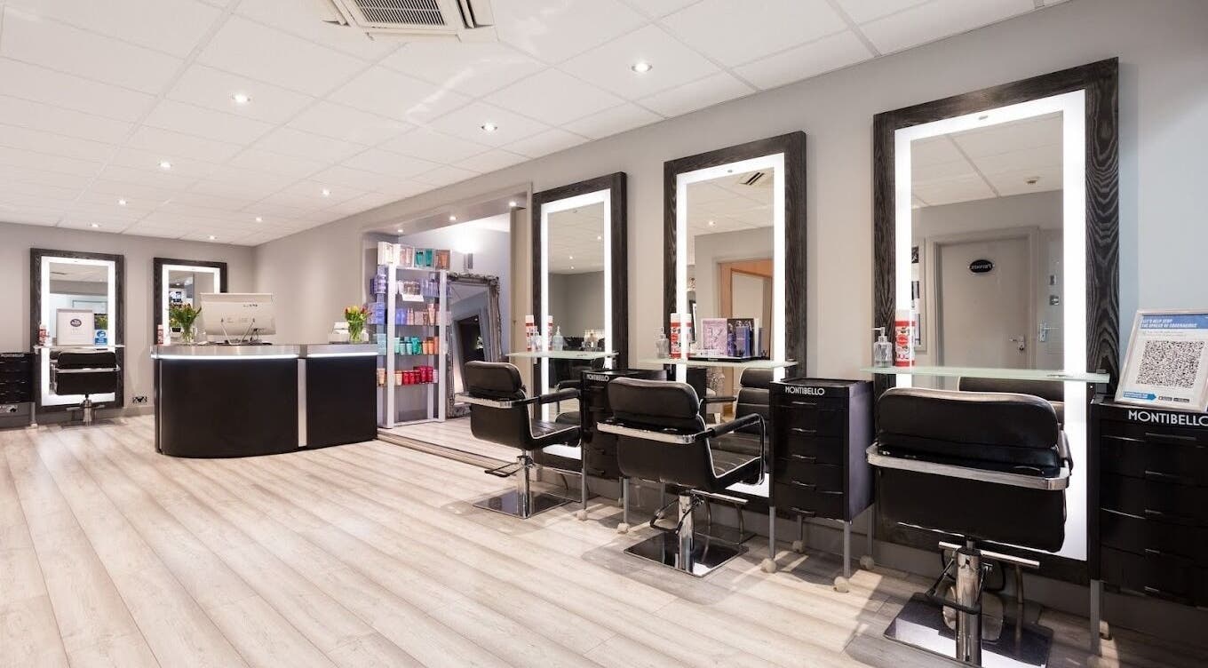 Elegant interior of Tranquillity Beauty & Hair Salon in Basildon, Essex, GB, featuring modern styling stations.