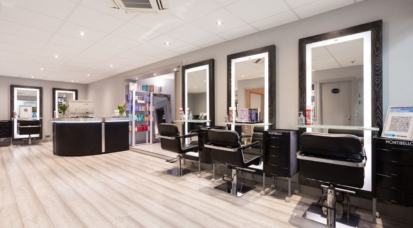 Elegant interior of Tranquillity Beauty & Hair Salon in Basildon, Essex, GB, featuring modern styling stations.