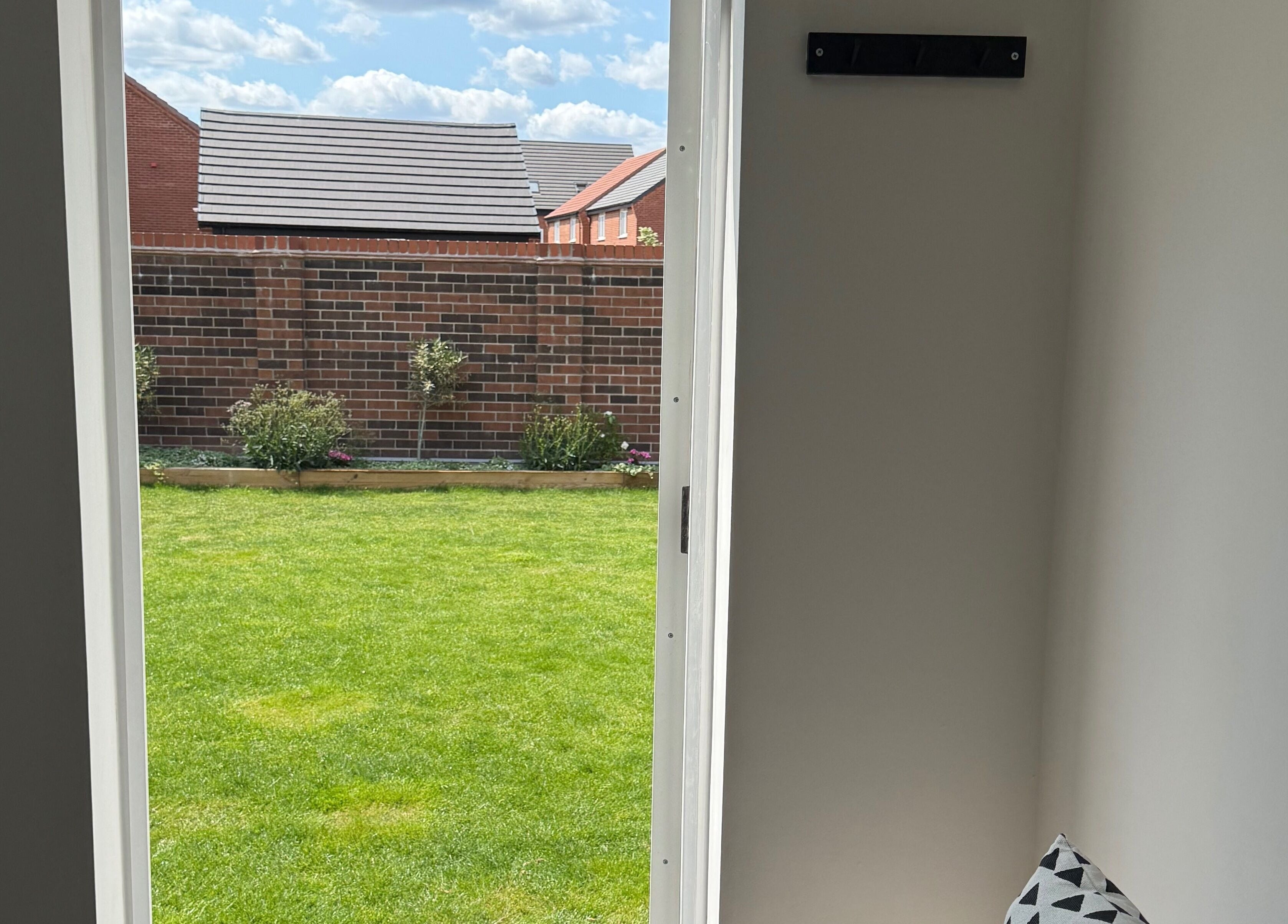 View of lush garden through door at The Brow Bar, Goole, England, GB enhancing tranquility.