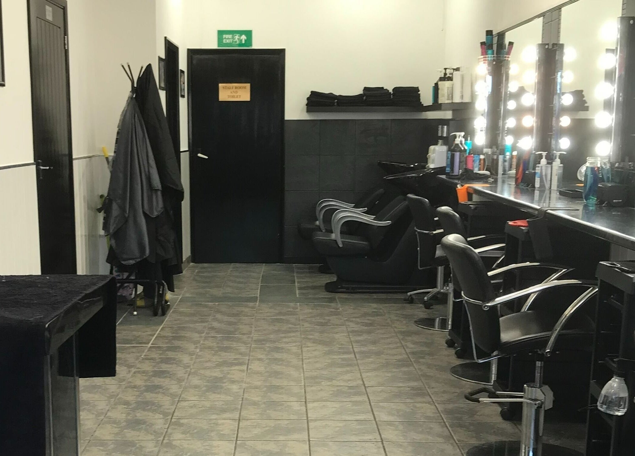 Modern and stylish salon interior at Hair and Body, Colchester, England, GB, featuring elegant styling chairs.