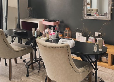 Stylish nail salon setup at The Boutique in Knowle, England, GB. Elegant chairs and manicure station.