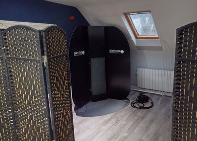 Private tanning area at The Boutique, Knowle, England, GB with stylish dividers and Sienna equipment.
