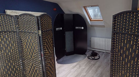 Private tanning area at The Boutique, Knowle, England, GB with stylish dividers and Sienna equipment.