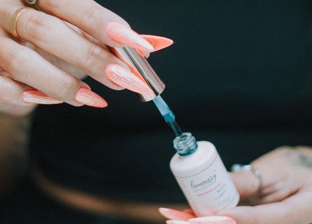 Close-up of vibrant nail polish application at So Nailz, Draper, Utah, US.
