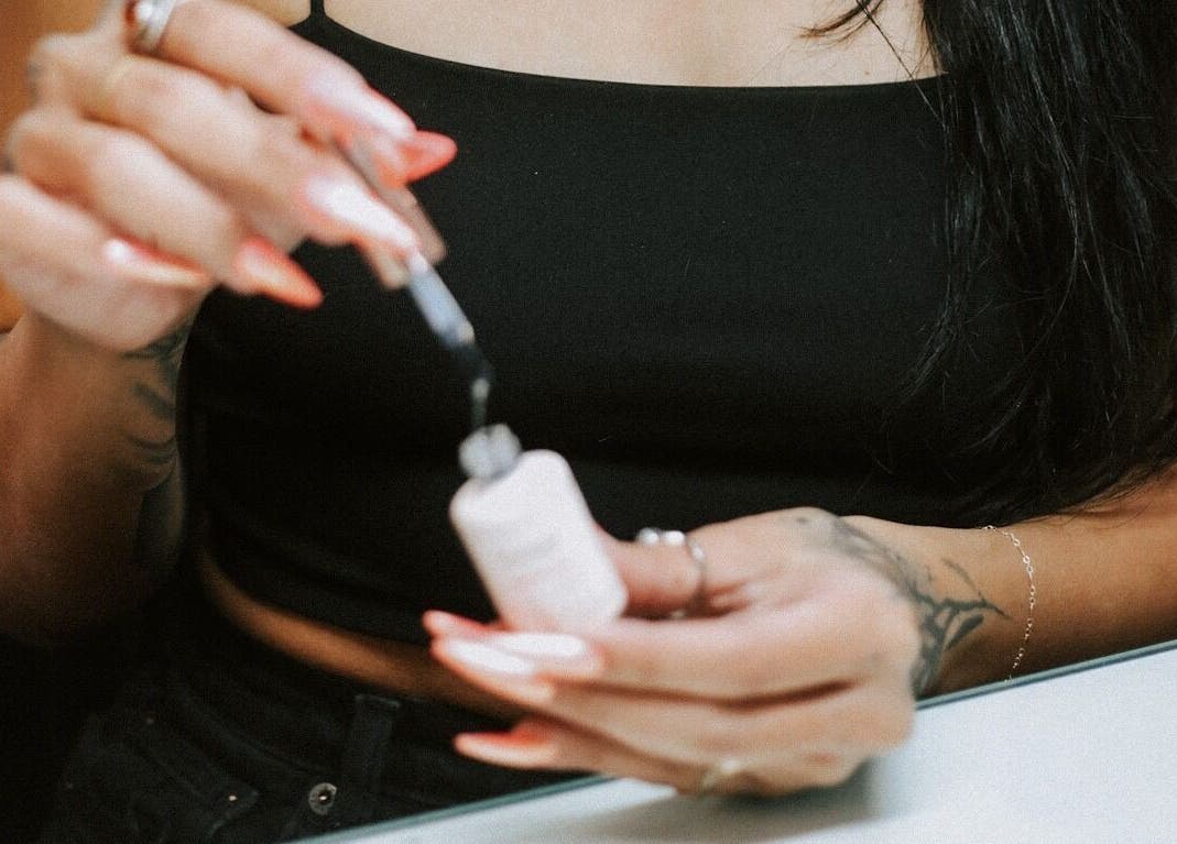 Close-up of nail polish application at So Nailz in Draper, Utah, US.