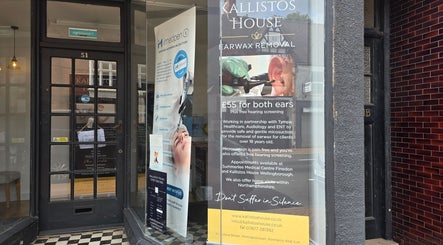 Entrance of Jane Smith Beauty in Wellingborough, England, GB, showcasing elegant signage and informational displays.