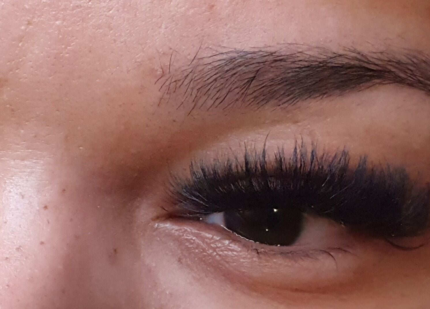 Close-up of expertly applied eyelash extensions at Jane Smith Beauty, Wellingborough, England, GB.