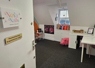Entrance to Nova Nails in Glasgow, Scotland, GB shows a cozy, vibrant interior inviting for relaxation.