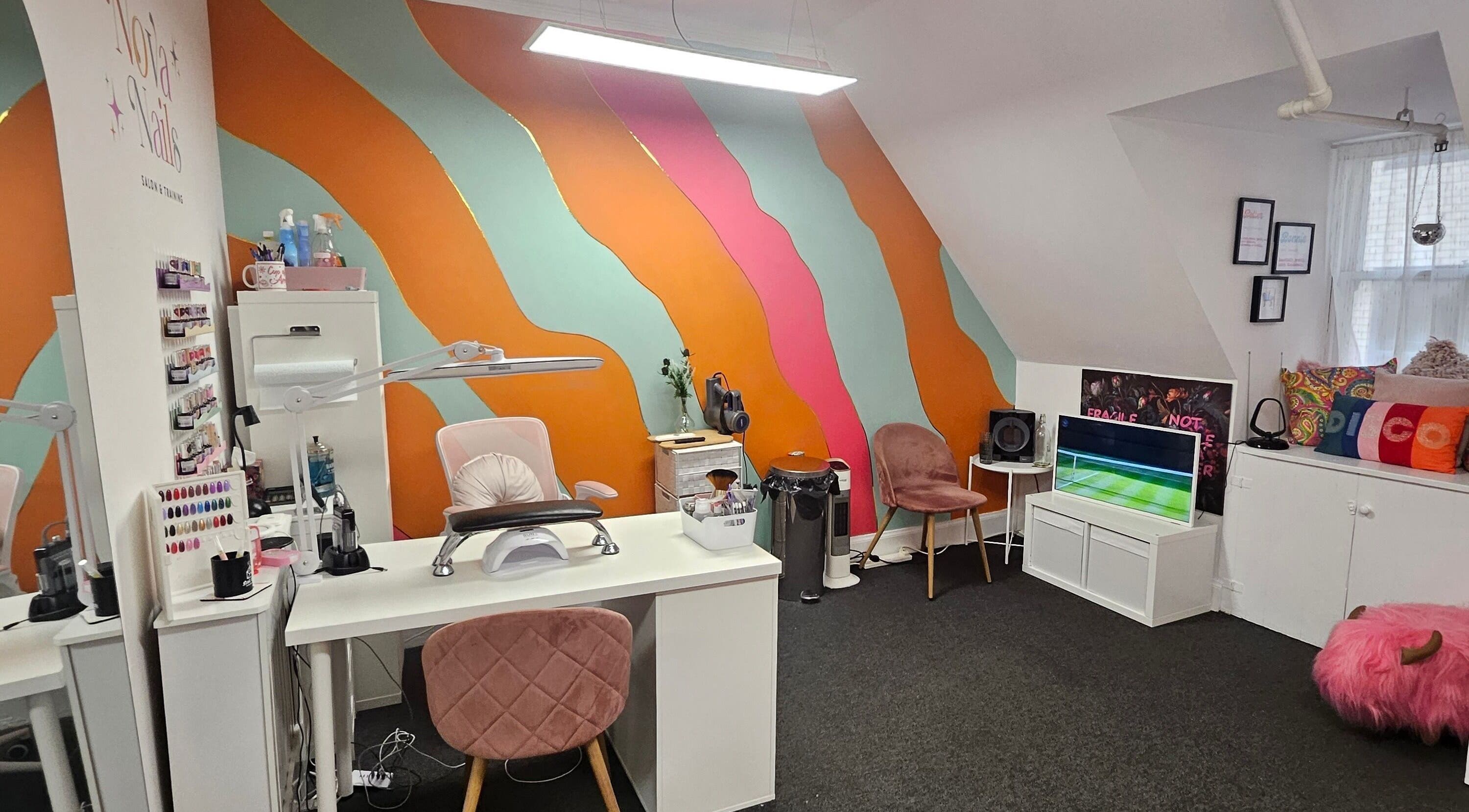 Nova Nails studio interior with colorful walls and nail stations in Glasgow, Scotland, GB.