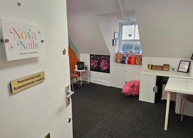 Cozy interiors of Nova Nails in Glasgow, Scotland, GB. Features inviting decor and warm ambiance.