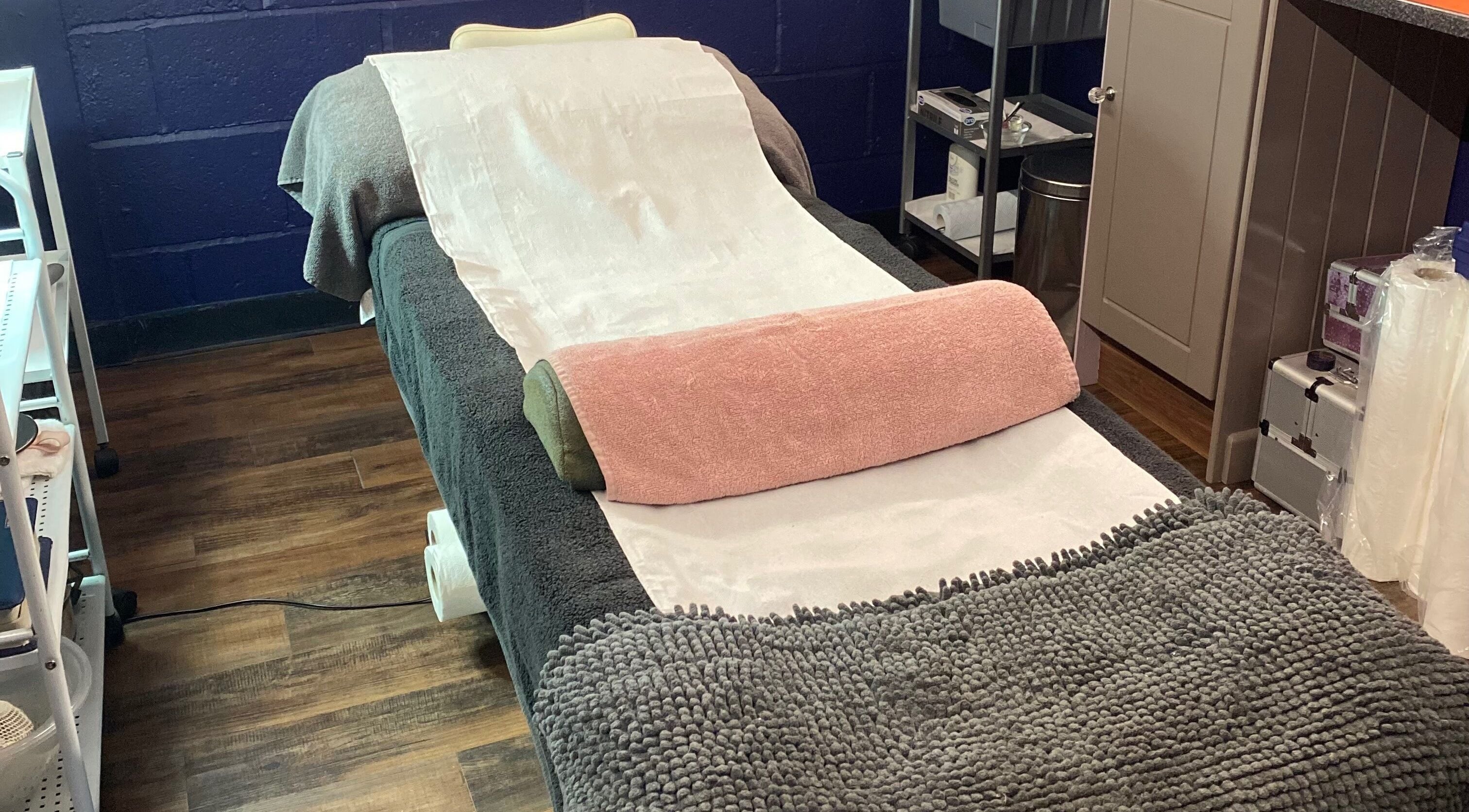 Massage bed at Kutz in St Austell, Cornwall, GB, offering a serene wellness experience.