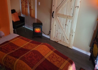 Cozy massage room at Cori's Healing Hands Massage, Edmonton, Alberta, CA with warm decor and soft lighting.
