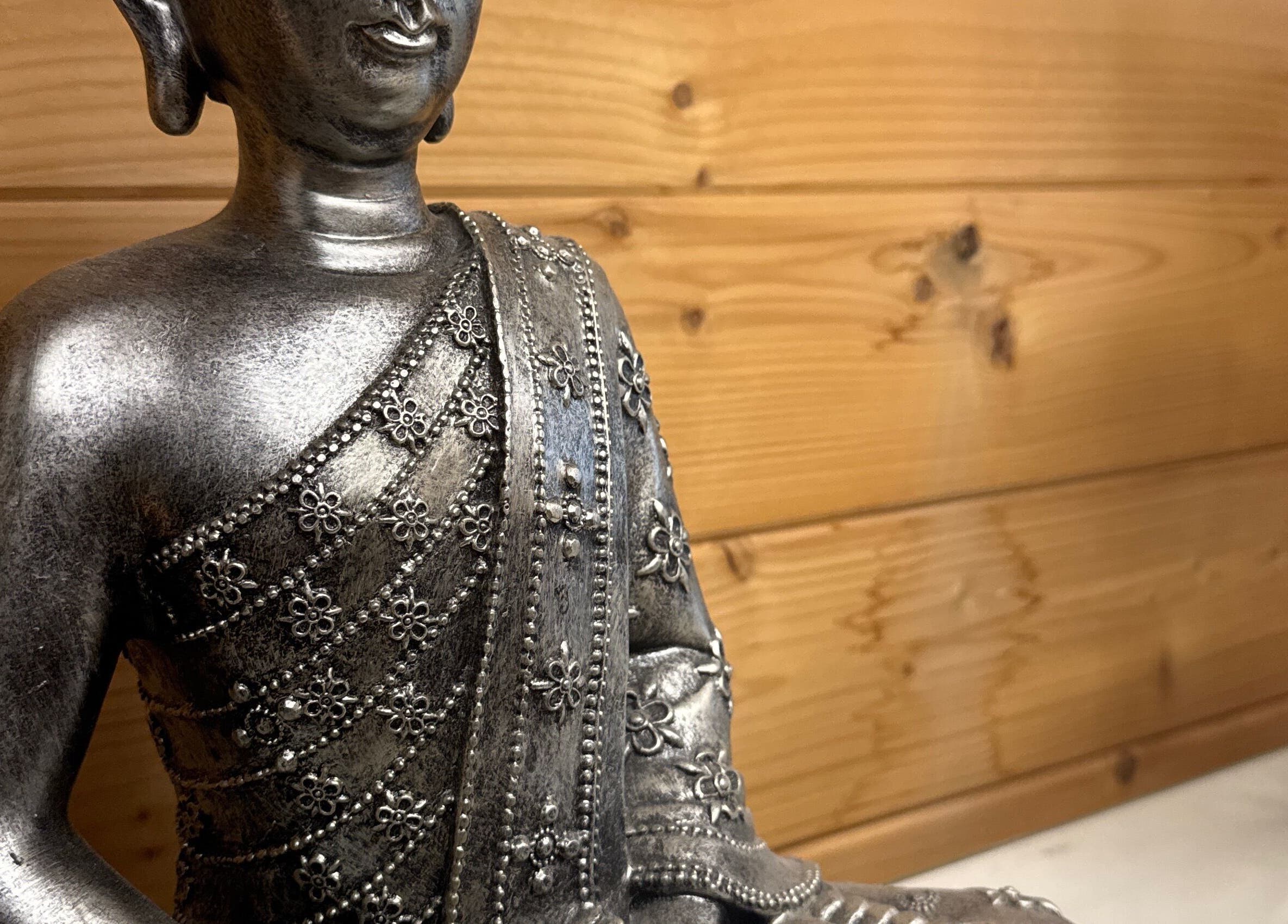 Elegant silver statue at Hygge Beauty Room, West Molesey, England, GB, enhancing a tranquil ambiance.