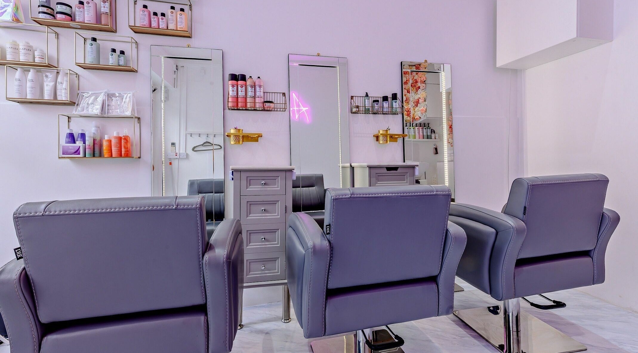 Modern salon chairs and beauty products in AKai, London, England, GB reflect a chic and stylish decor.