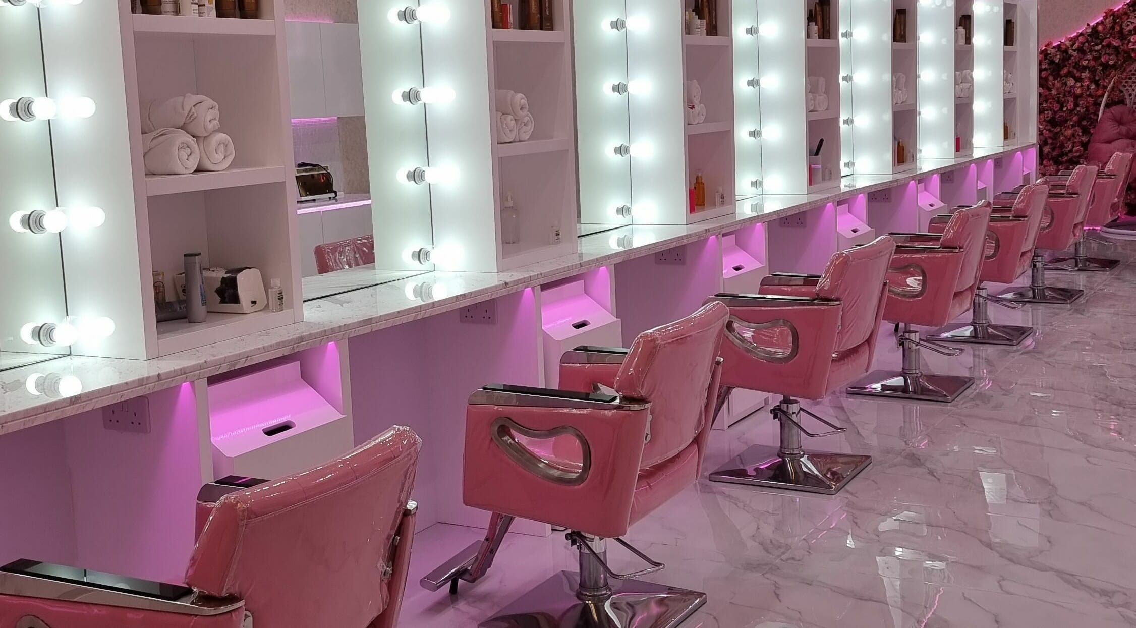 Lavish seating at Mrs Cutting Edge Ladies Salon - Silicon Central Mall DSO, Dubai, Dubai, AE with pink decor.