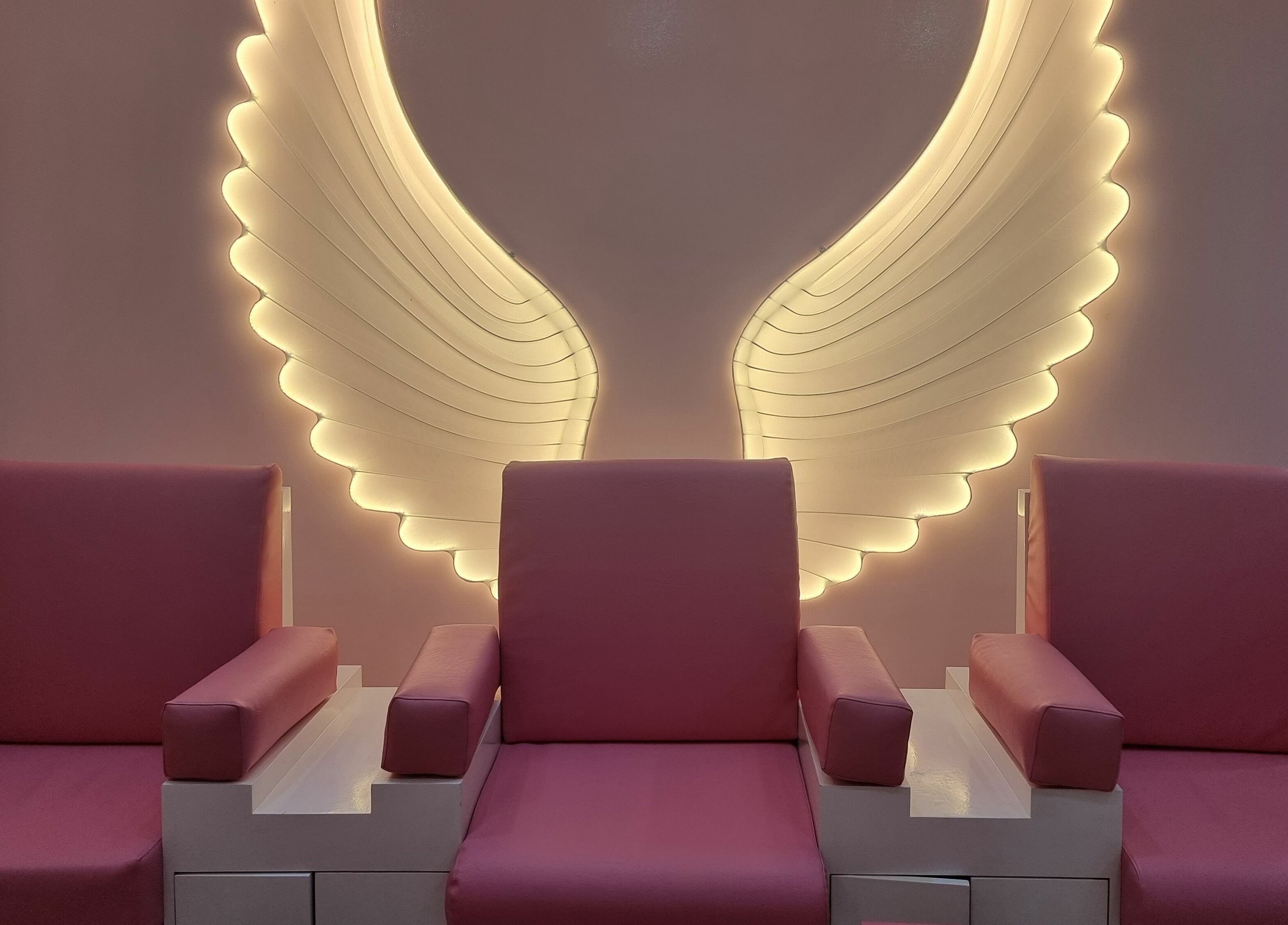 Elegant seating with angel wing lights at Cutting Edge Hair Lounge Dmcc - Cluster U JLT, Dubai, Dubai, AE.