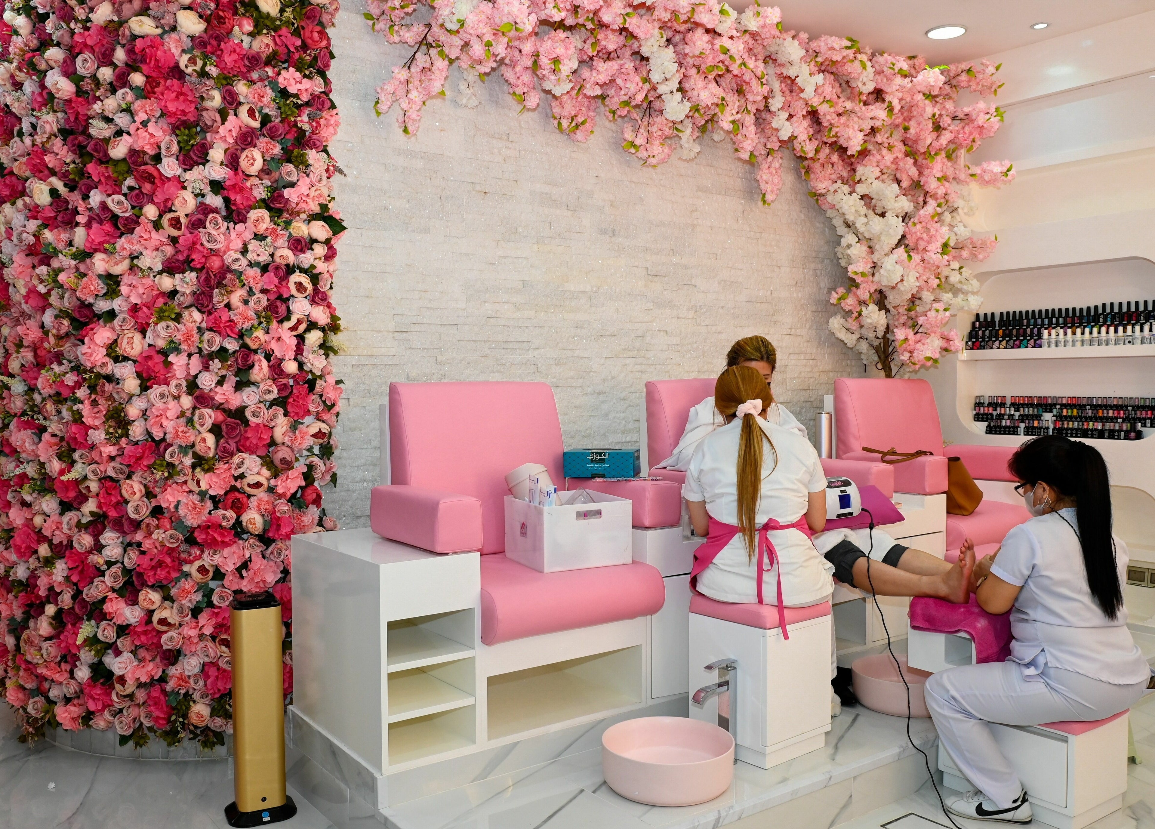 Elegant pink nail salon at Cutting Edge Hair Lounge Dmcc - Cluster U JLT, Dubai, Dubai, AE with floral decor.