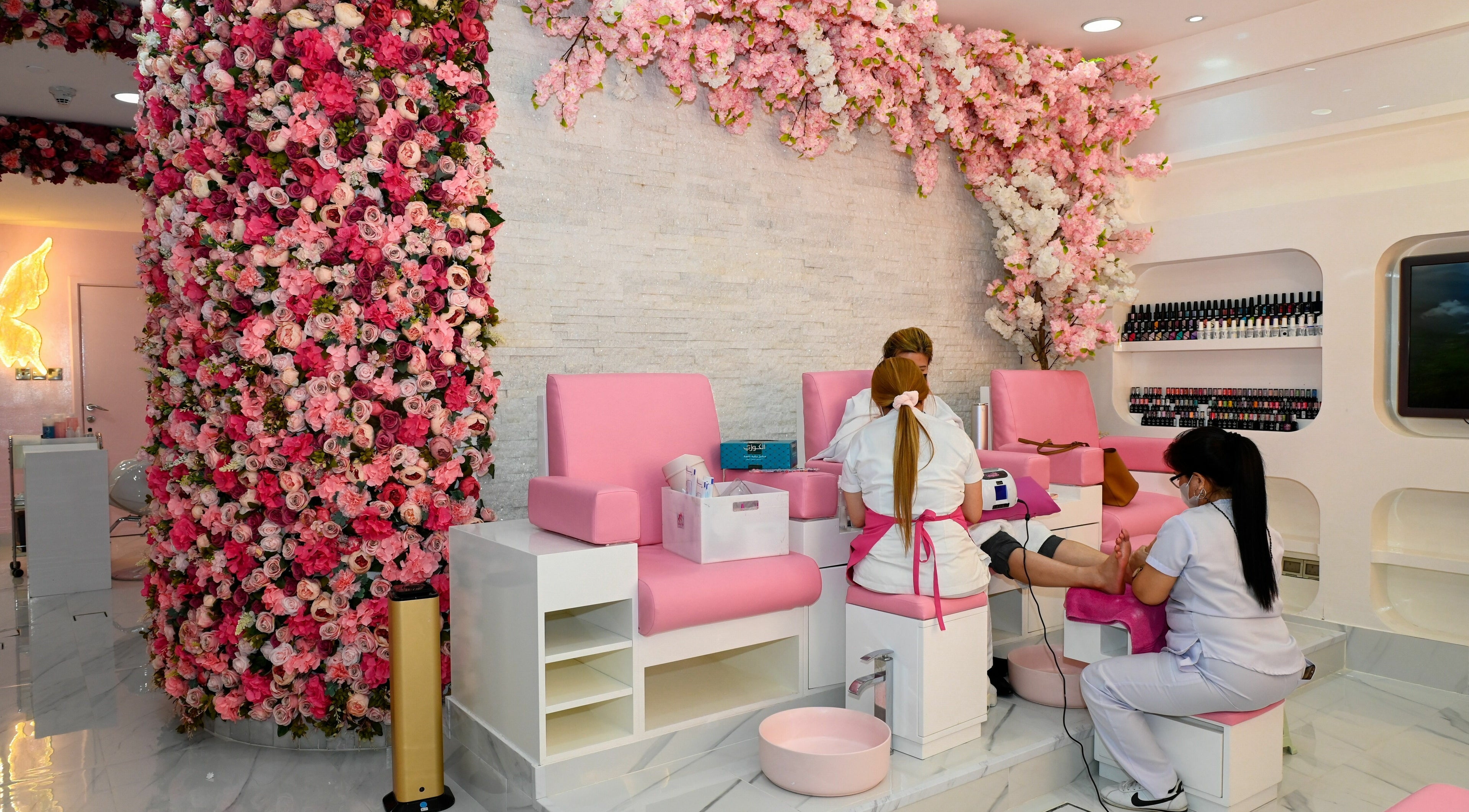 Elegant pink nail salon at Cutting Edge Hair Lounge Dmcc - Cluster U JLT, Dubai, Dubai, AE with floral decor.
