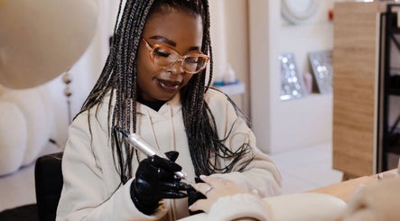 Nail artist at Fix Her Crown in Benoni, Gauteng, ZA, creating beautiful designs for clients.