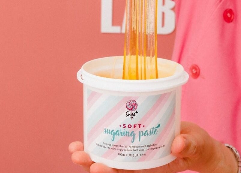 Sugaring paste in hand at Sweet Lab Applecross, Applecross, Western Australia, AU for gentle hair removal.