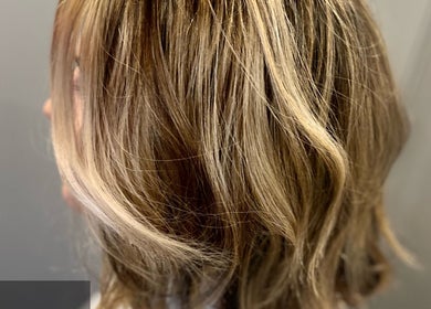 Elegant blonde waves styled at Liam Dawson Hair, Ashford, England, GB. Perfect salon finish.