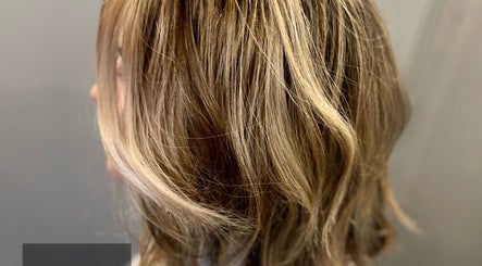 Elegant blonde waves styled at Liam Dawson Hair, Ashford, England, GB. Perfect salon finish.