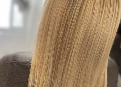 Gleaming blonde hair from Liam Dawson Hair, Ashford, England, GB, showcasing expert styling.