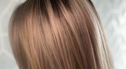 Stylish hair highlights at Liam Dawson Hair in Betherson, England, GB showcasing glossy brunette tones.