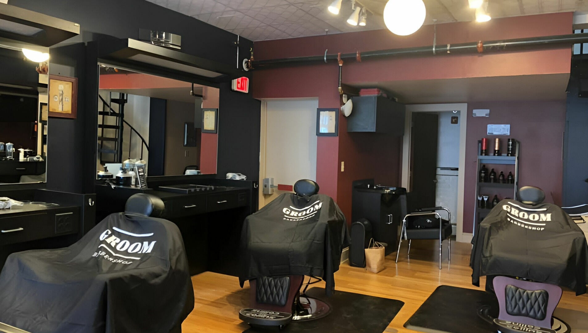 Stylish interior of Groom Barbershop in Easthampton, Massachusetts, US with sleek barber chairs.