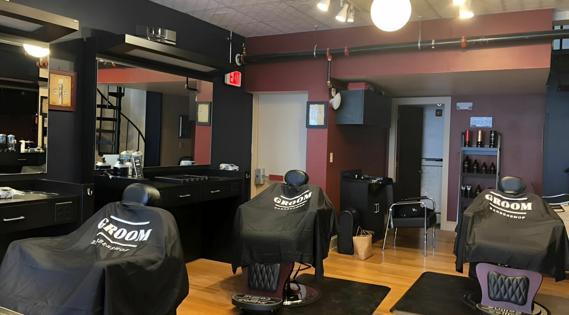 Stylish interior of Groom Barbershop in Easthampton, Massachusetts, US with sleek barber chairs.