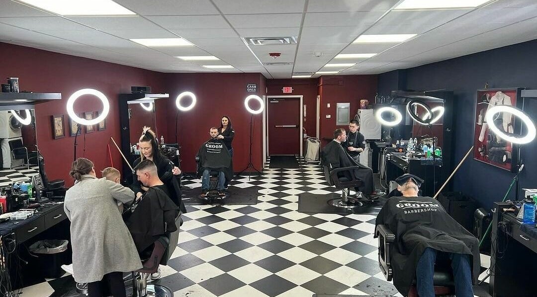 Interior of Groom Barbershop in Easthampton, Massachusetts, US showcasing haircuts in progress.