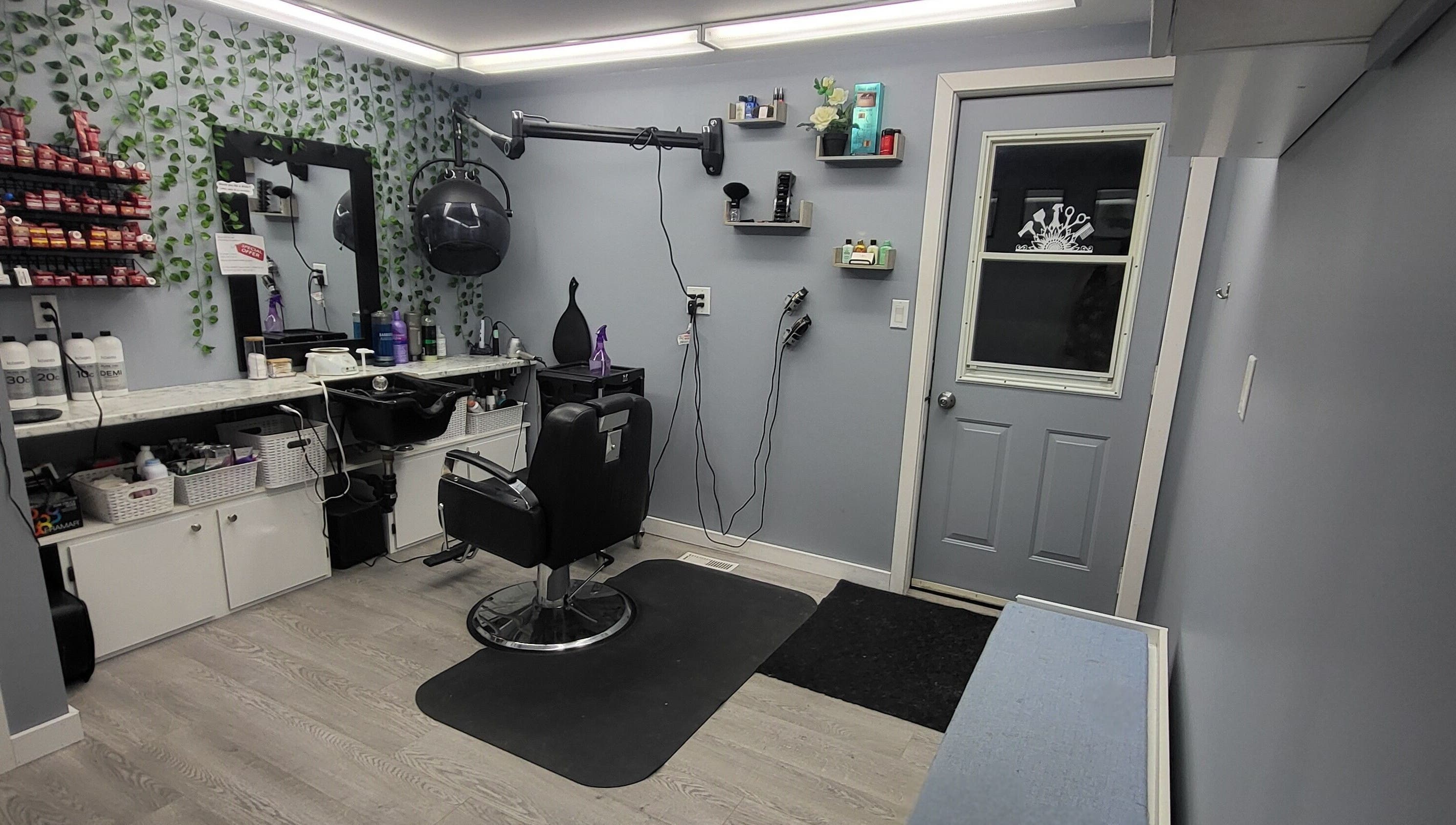 Modern interior of Tiffany's Home Salon in Ste-Geneviève, Manitoba, CA with stylish decor and hair styling station.