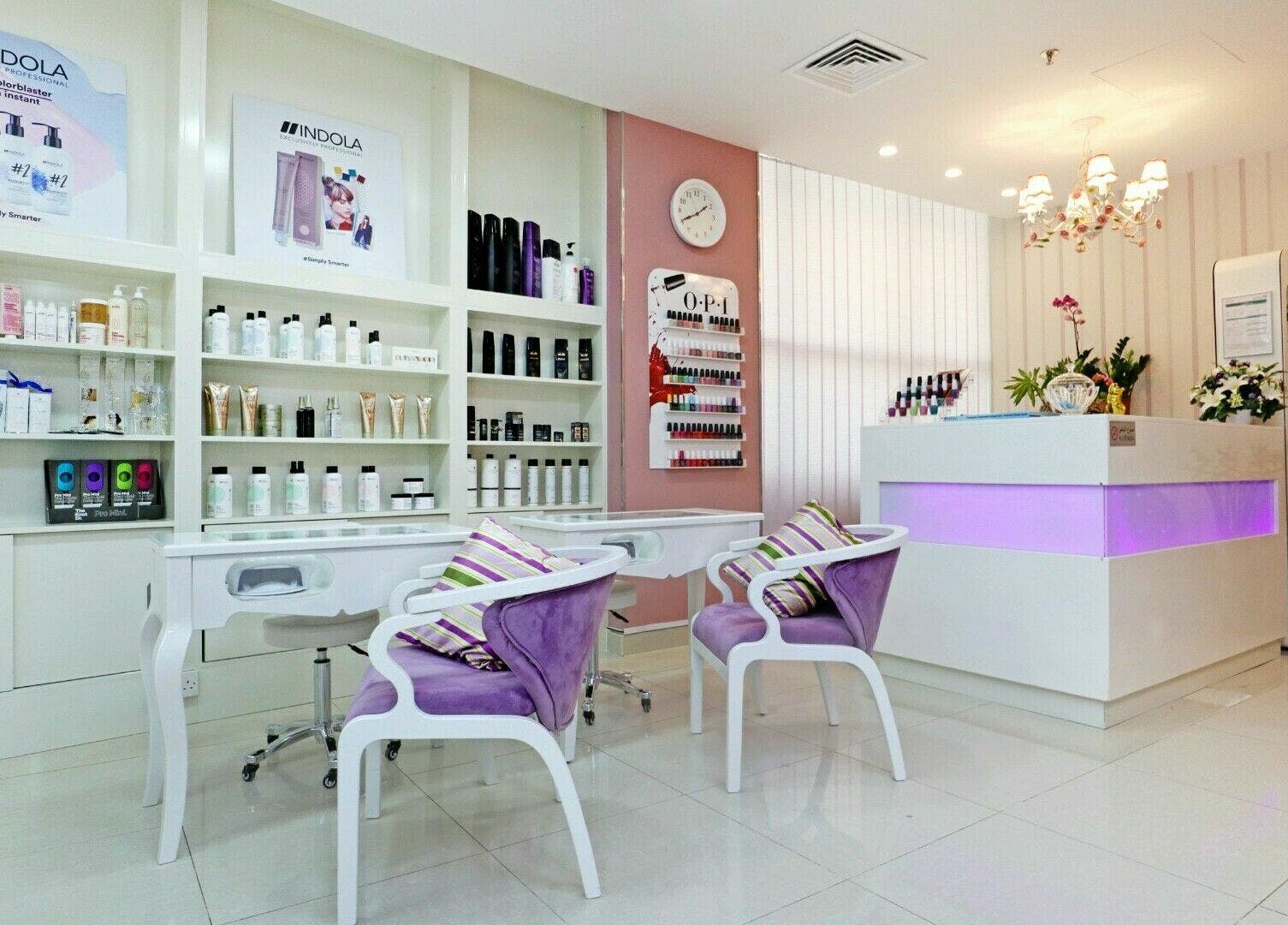 Relaxing interior of Cleopatra Beauty Salon & Spa in Dubai, Dubai, AE with chairs and beauty products on display.