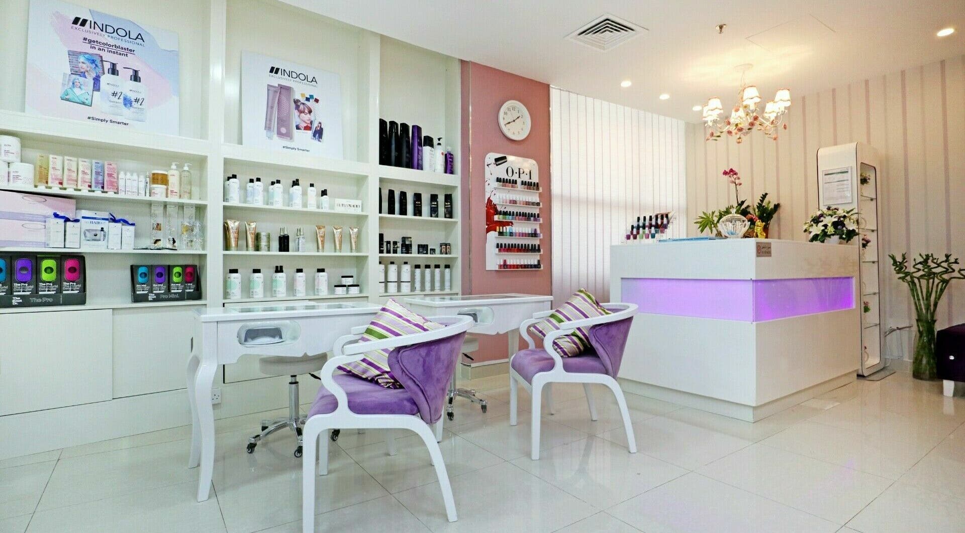 Relaxing interior of Cleopatra Beauty Salon & Spa in Dubai, Dubai, AE with chairs and beauty products on display.