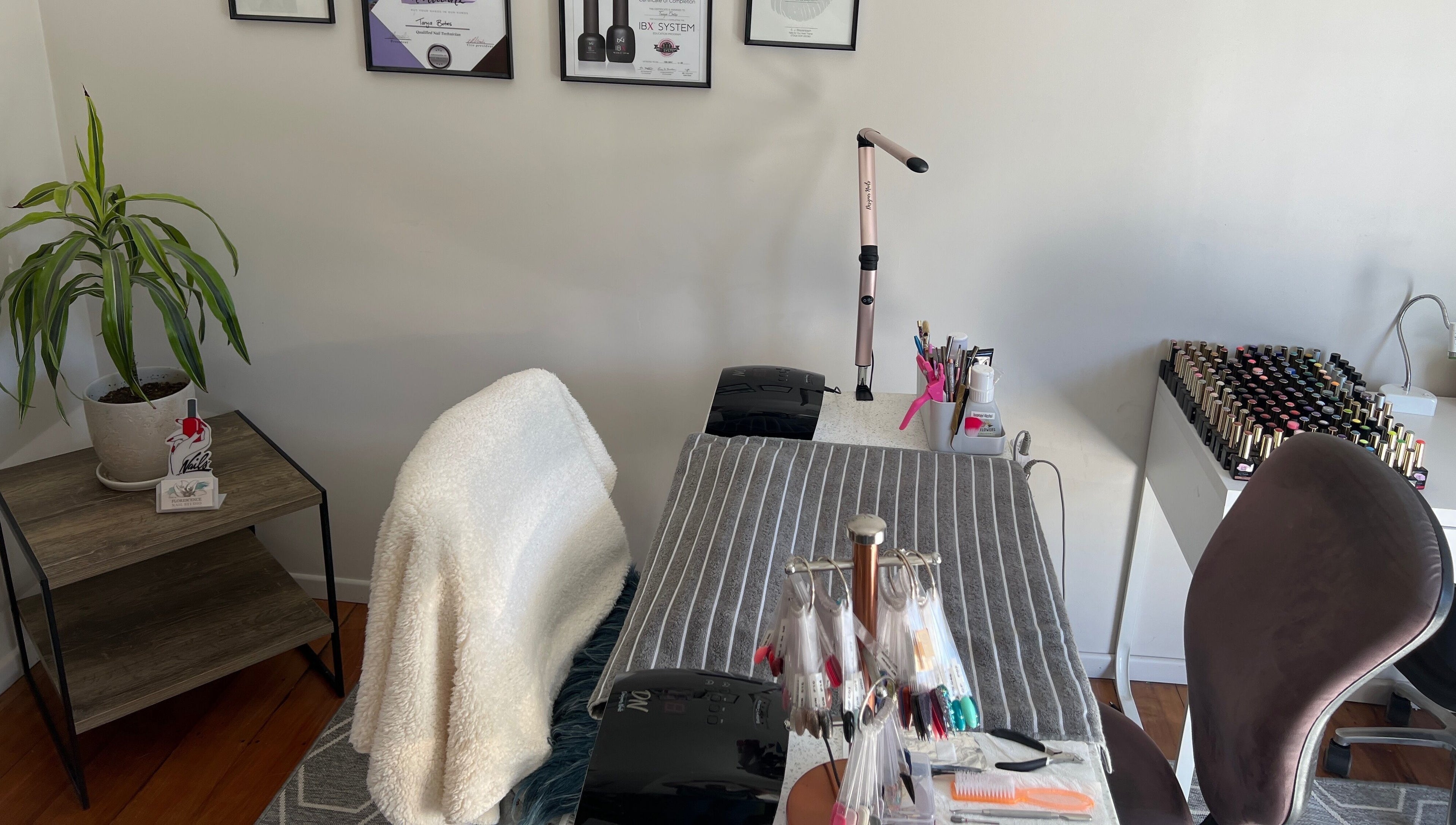 Chic nail station at Floresence Nail Studio in Masterton, Wellington Region, NZ with tools and polishes.