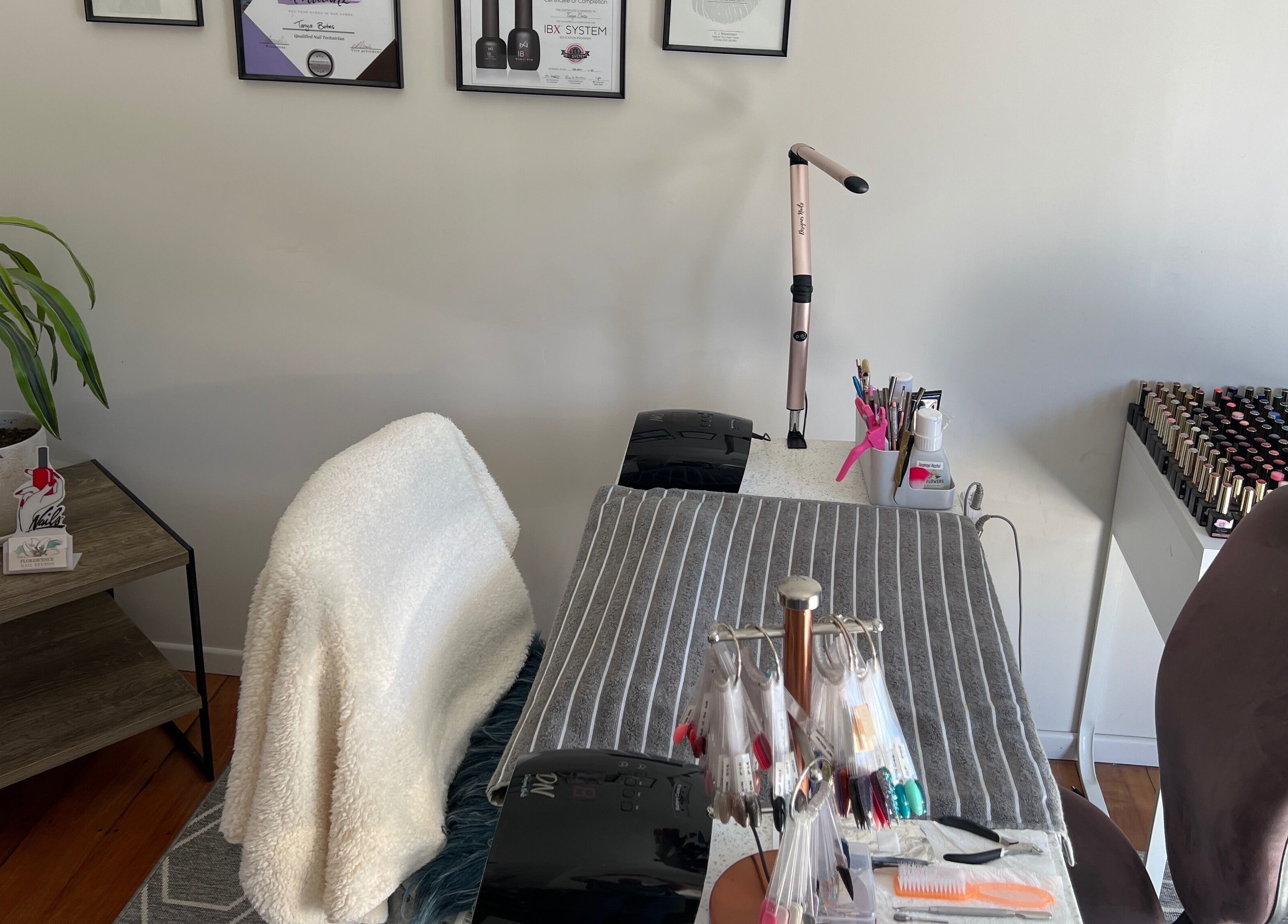 Chic nail station at Floresence Nail Studio in Masterton, Wellington Region, NZ with tools and polishes.