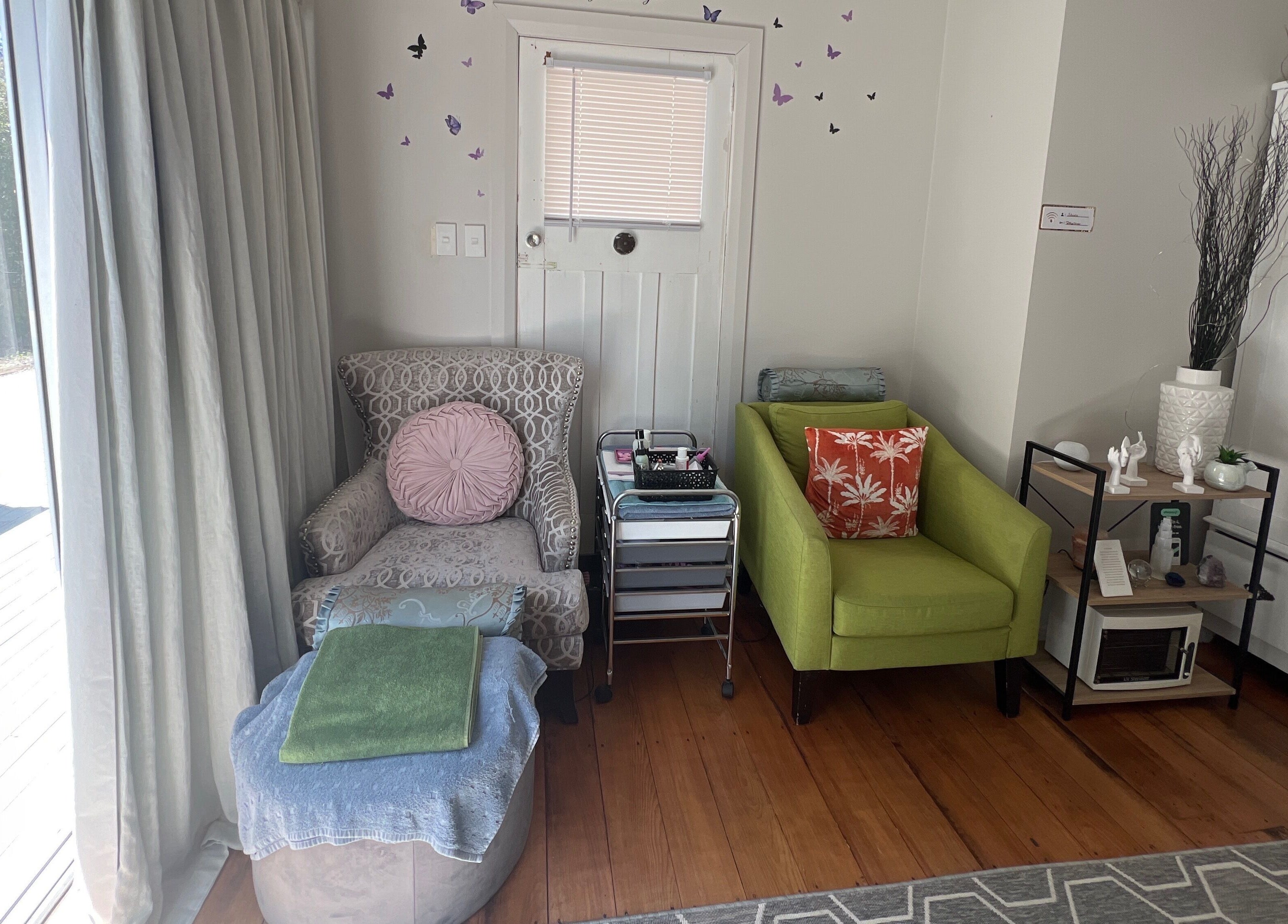 Relaxing seating area at Floresence Nail Studio, Masterton, Wellington Region, NZ, with comfy chairs and soft lighting.