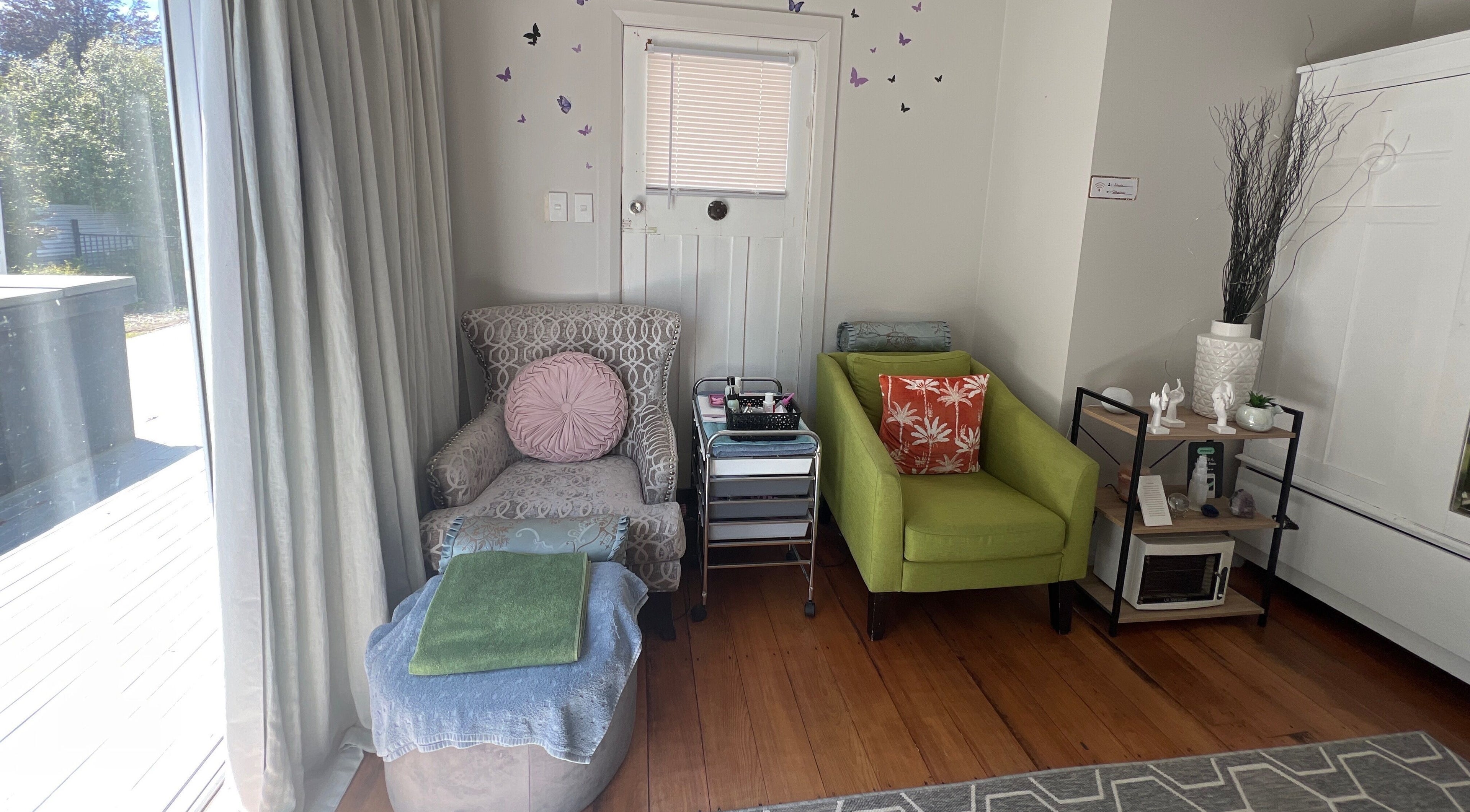 Relaxing seating area at Floresence Nail Studio, Masterton, Wellington Region, NZ, with comfy chairs and soft lighting.
