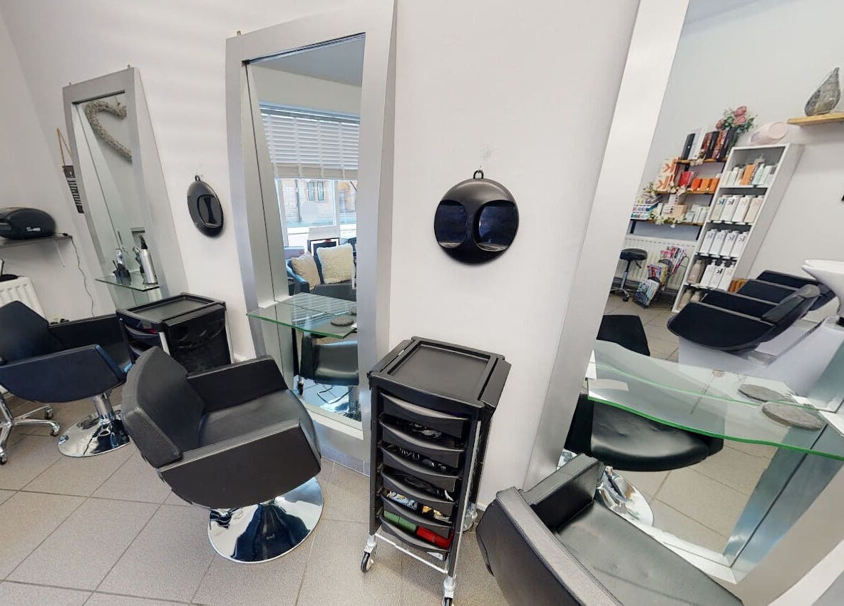 Chic interior of House of Hair, Somerton, England, GB, showcasing modern styling chairs and mirrors.